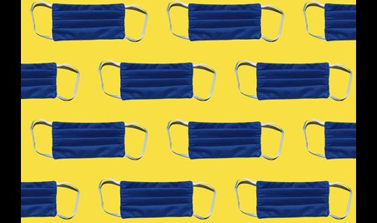 blue face masks on yellow background tiled