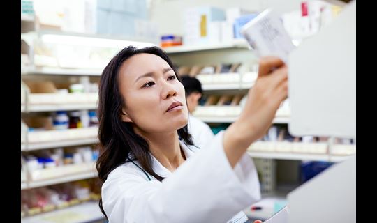 pharmacist female pulling product