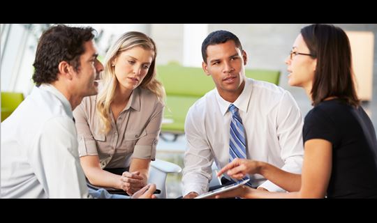 4 people having a discussion